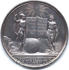 Cadiz:Medalla conmemorativa de la Constitución de 1812 acuñada en Cádiz en ese mismo año por Félix Sagan. Bajo estrella radiante, dos guerreros (España y América) se dan la mano sobre el libro de la Constitución que reposa sobre dos mundos en el que figura la leyenda: 